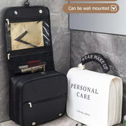 Borsa da viaggio per trucco nera e bianca, appendibile, con scomparti trasparenti e tasche multiple, ideale per organizzare cosmetici e accessori.