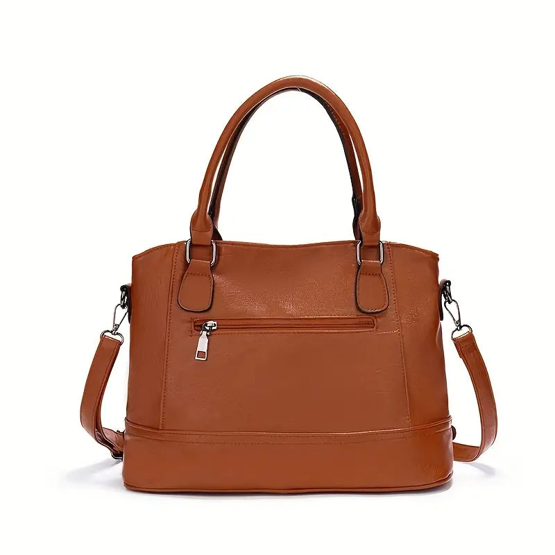 Borsa a mano in pelle marrone con tracolla regolabile, tasca frontale con zip, design elegante e spazioso. Accessorio moda donna.