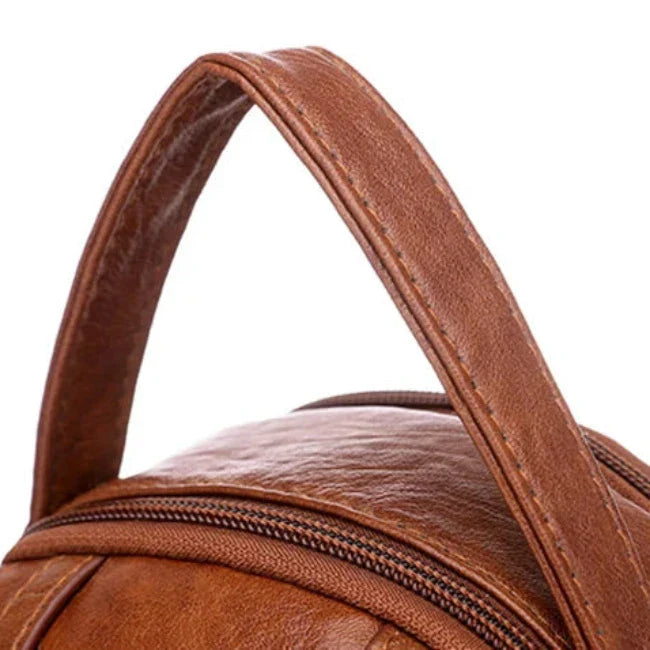 Manico borsa in pelle marrone, dettaglio cerniera, design elegante e resistente, accessorio moda uomo e donna, alta qualità artigianale.