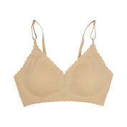 Reggiseno senza cuciture beige con spalline regolabili, design a coppa morbida, ideale per comfort quotidiano. Intimo donna elegante e confortevole.