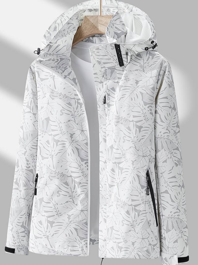 Giacca impermeabile donna bianca con cappuccio, motivo foglie tropicali, chiusura zip, tasche laterali, ideale per outdoor e sport.