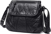 Borsa a tracolla in pelle nera, design elegante con cerniera frontale, ideale per moda donna. Accessorio versatile e di tendenza.