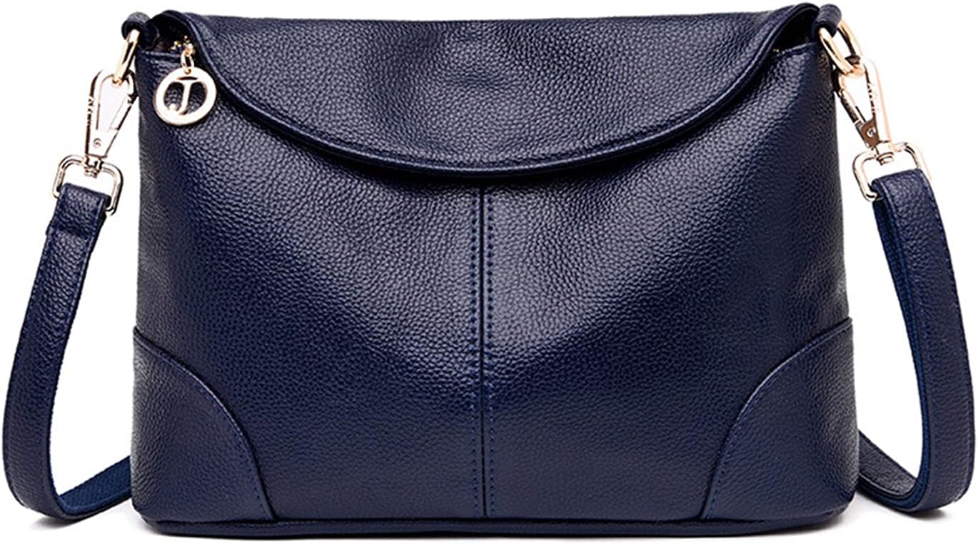 Borsa a tracolla in pelle blu scuro con chiusura a zip, dettagli in metallo dorato e ciondolo decorativo. Elegante e versatile per ogni occasione.