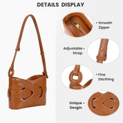Borsa a tracolla in pelle marrone con cerniera liscia, cuciture fini, design unico e tracolla regolabile. Accessorio moda elegante e funzionale.