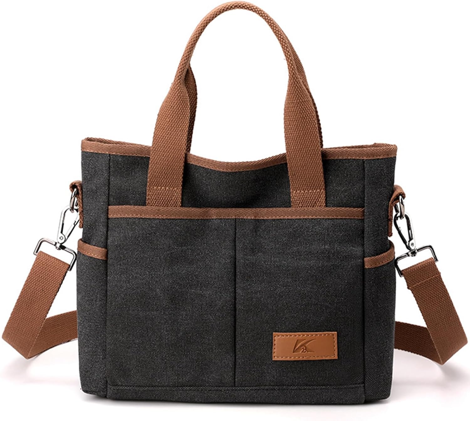 Borsa a tracolla in tela nera con manici marroni, tasche frontali e tracolla regolabile. Design casual, ideale per uso quotidiano e viaggi.