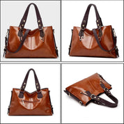 Borsa a mano in pelle marrone, design elegante, manici robusti, dettagli metallici dorati, perfetta per moda donna e accessori di lusso.