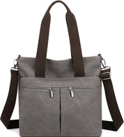 Borsa a tracolla in tela grigia con doppia cerniera, manici marroni e tracolla regolabile. Design casual, ideale per uso quotidiano.