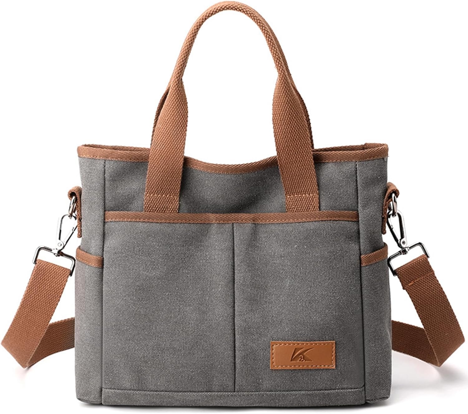 Borsa a tracolla in tela grigia con manici marroni, tasche esterne e tracolla regolabile. Design casual, ideale per uso quotidiano e shopping.