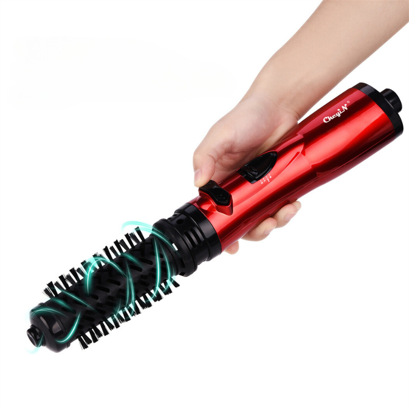 Spazzola rotante elettrica rossa, design ergonomico, impugnatura comoda, ideale per styling capelli, tecnologia ionica, multifunzione.