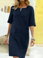 Abito donna blu scuro, maniche corte, scollo a V, stile casual elegante. Perfetto per occasioni estive e primaverili. Tessuto leggero e confortevole.