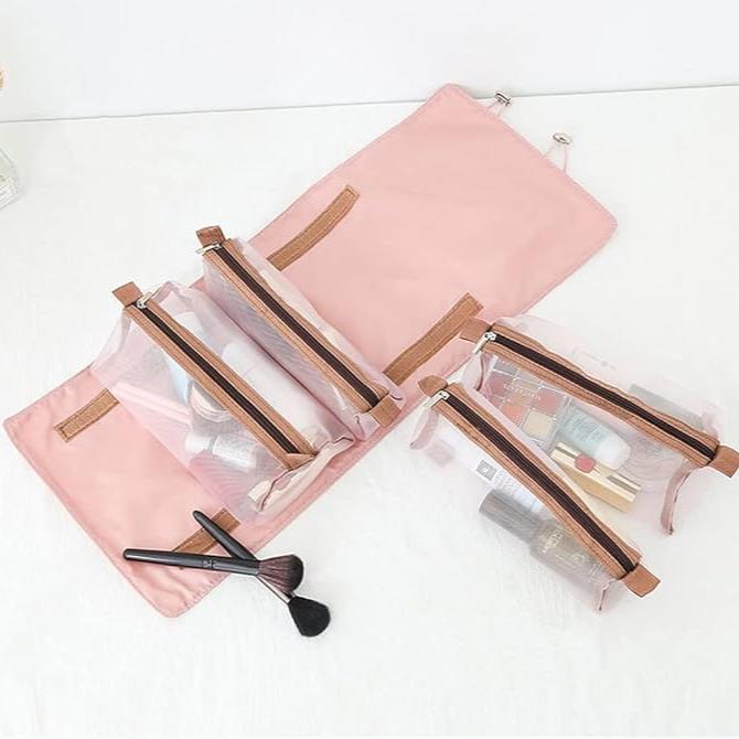 Astuccio da viaggio rosa con scomparti trasparenti, ideale per cosmetici e accessori trucco. Design pieghevole, pratico e organizzato.