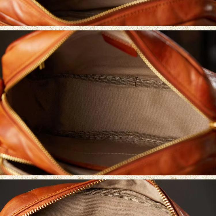 Borsa in pelle marrone con cerniera aperta, interno spazioso in tessuto beige. Accessorio moda elegante, ideale per uso quotidiano.