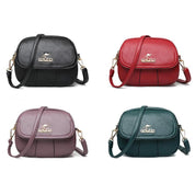 Quattro borse a tracolla in pelle PU, colori nero, rosso, viola e verde, con logo Jingpin. Design elegante, chiusura a zip, ideale per moda femminile.