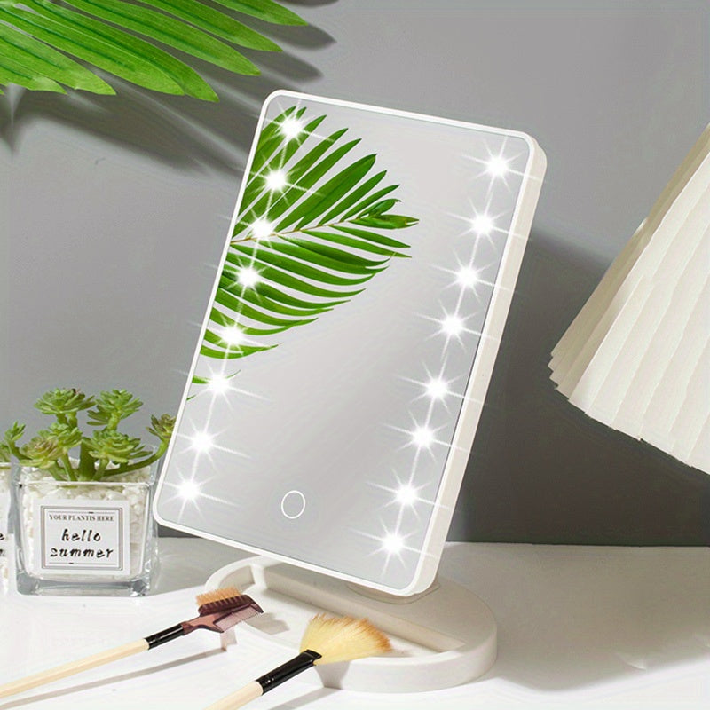 Specchio cosmetico LED rettangolare con cornice bianca, riflesso di foglia verde, base regolabile, ideale per trucco, illuminazione uniforme.