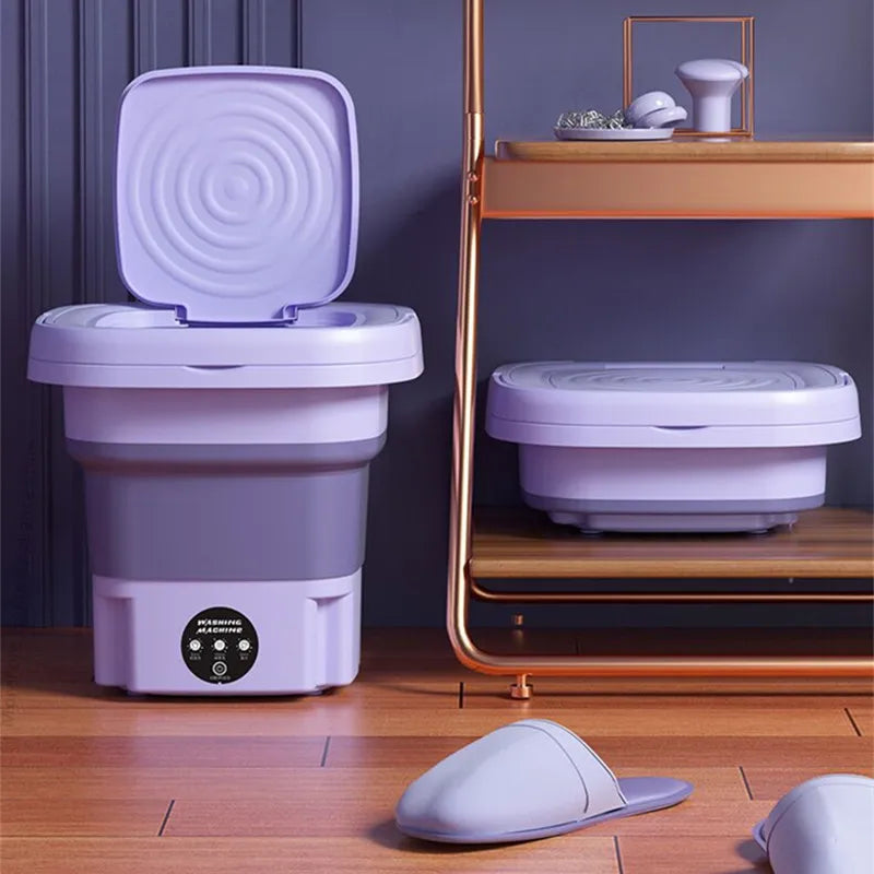 Lavatrice portatile pieghevole viola, design compatto, ideale per piccoli spazi. Perfetta per viaggi, campeggio e appartamenti. Accessori inclusi.