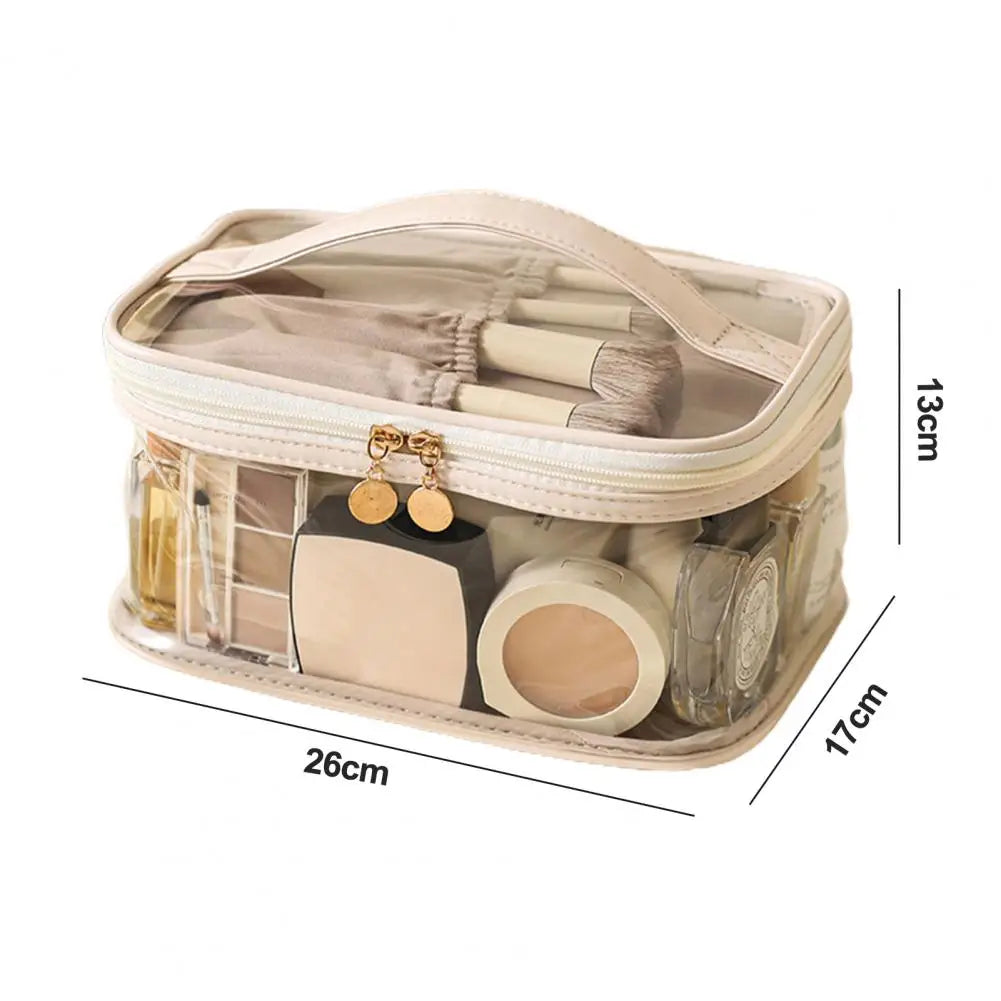Borsa trasparente per cosmetici, 26x17x13 cm, con cerniera dorata, contenente trucchi e accessori. Ideale per organizzare prodotti di bellezza.