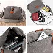 Borsa a tracolla in tela grigia con cerniera, tasche multiple, spazio per smartphone, occhiali, portafoglio. Design casual e pratico per uso quotidiano.