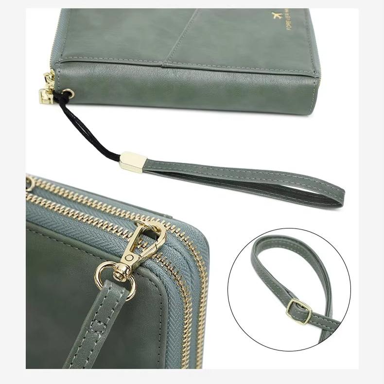 Portafoglio donna in pelle verde con cerniera dorata, cinturino da polso regolabile. Design elegante, accessorio moda femminile.