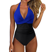 Costume intero donna blu e nero, design incrociato, scollo all'americana, ideale per spiaggia e piscina, moda mare estate 2023.
