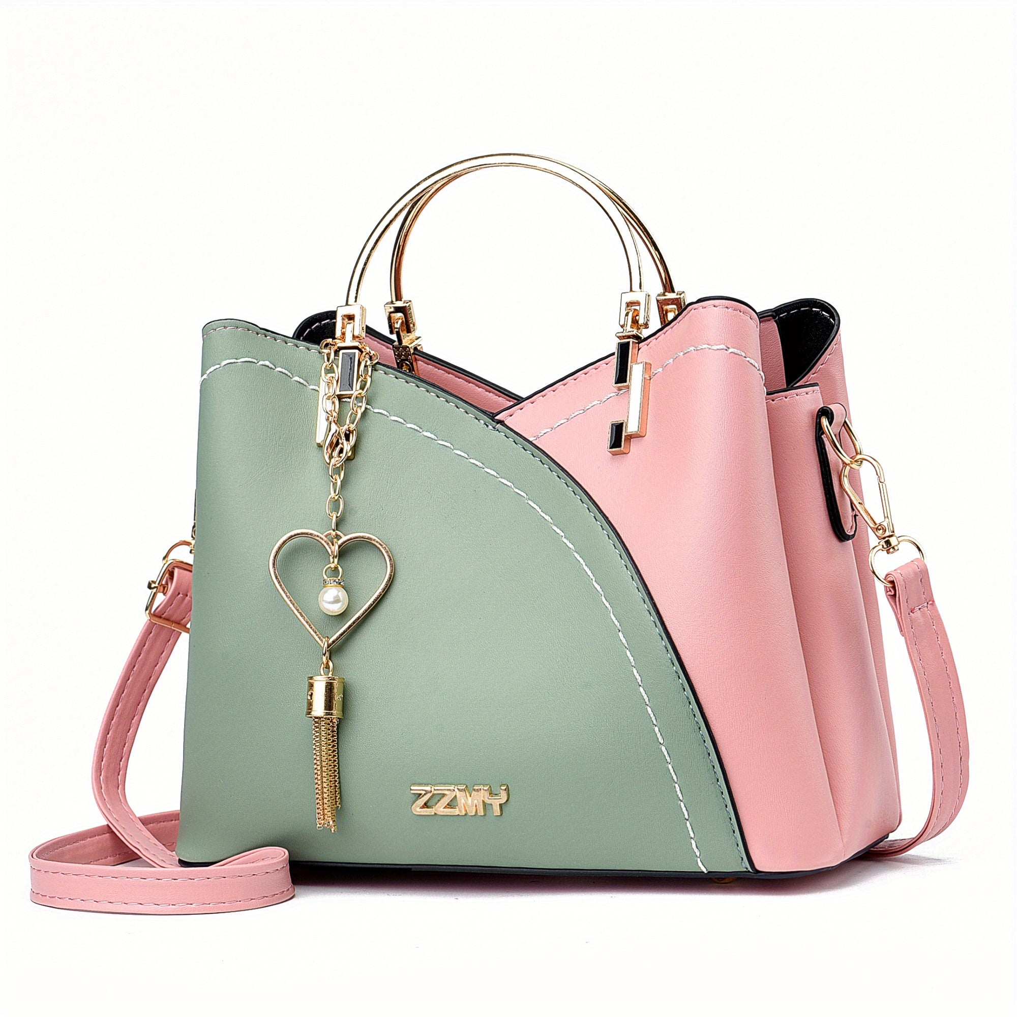 Borsa a tracolla donna in pelle verde e rosa, design elegante con manico dorato e ciondolo a cuore. Accessorio moda femminile chic e versatile.