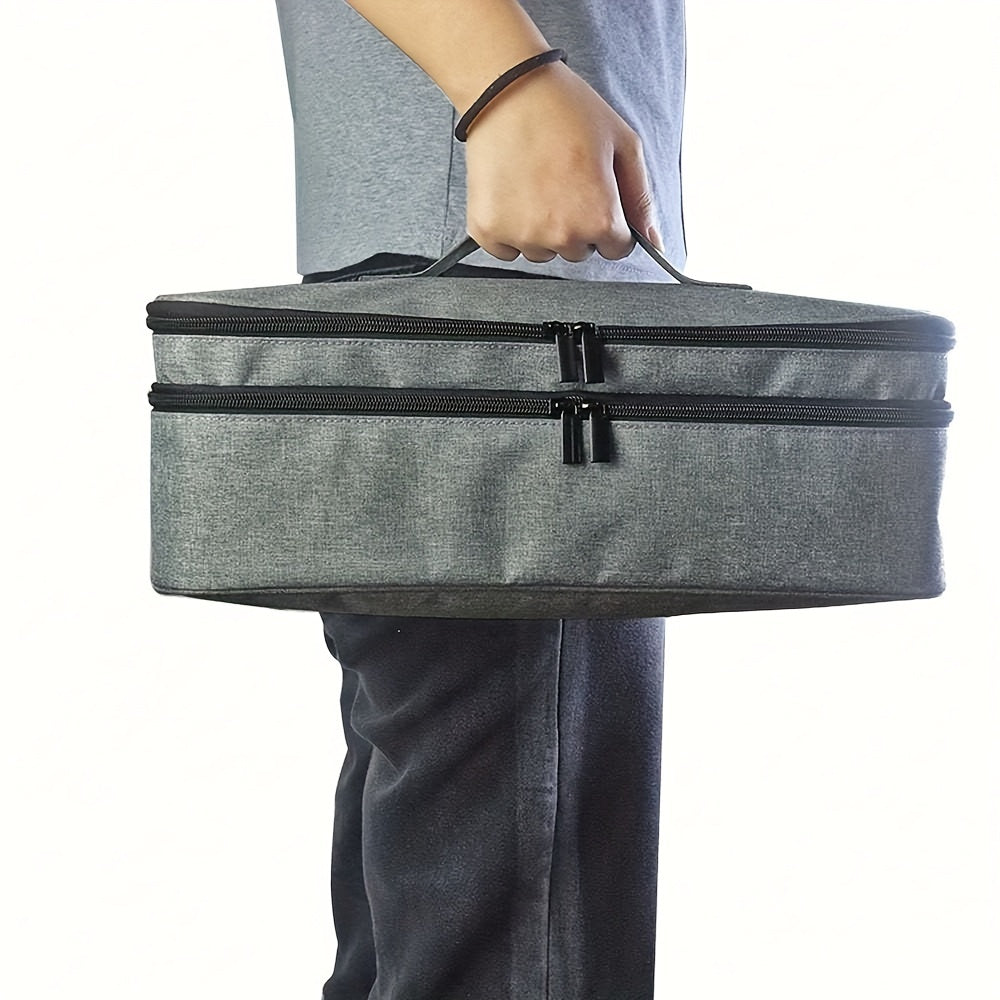 Borsa termica grigia con doppia cerniera, manico robusto, ideale per trasporto cibo e bevande. Design moderno, perfetta per picnic e viaggi.
