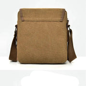 Borsa a tracolla in tela marrone, design minimalista, chiusura superiore, ideale per uomo e donna, perfetta per uso quotidiano e viaggi.