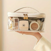 Borsa trasparente per cosmetici con trucco di lusso, include cipria, ombretti e pennelli. Ideale per organizzare prodotti di bellezza.