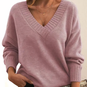 Maglione donna rosa pastello, scollo a V, maniche lunghe, tessuto morbido, stile casual chic, perfetto per autunno e inverno.