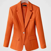 Giacca arancione elegante da donna, tessuto strutturato, monopetto, con tasche, ideale per abbigliamento formale e casual. Moda autunno-inverno.