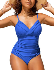 Costume intero blu donna, design incrociato, spalline sottili, ideale per spiaggia e piscina, moda mare estate, tessuto elasticizzato.