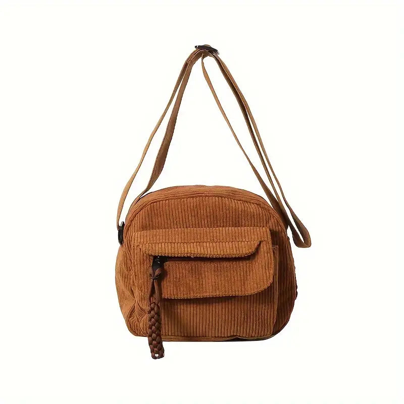Borsa a tracolla in velluto a coste marrone, tasca frontale con chiusura a zip, design casual, ideale per moda donna e accessori autunno.