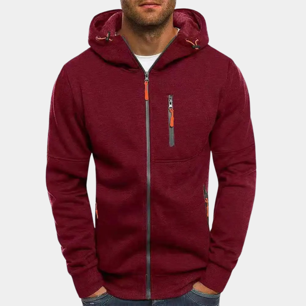 Felpa con cappuccio uomo bordeaux, zip frontale, tasche laterali con cerniera, design casual, ideale per autunno e inverno, moda maschile.