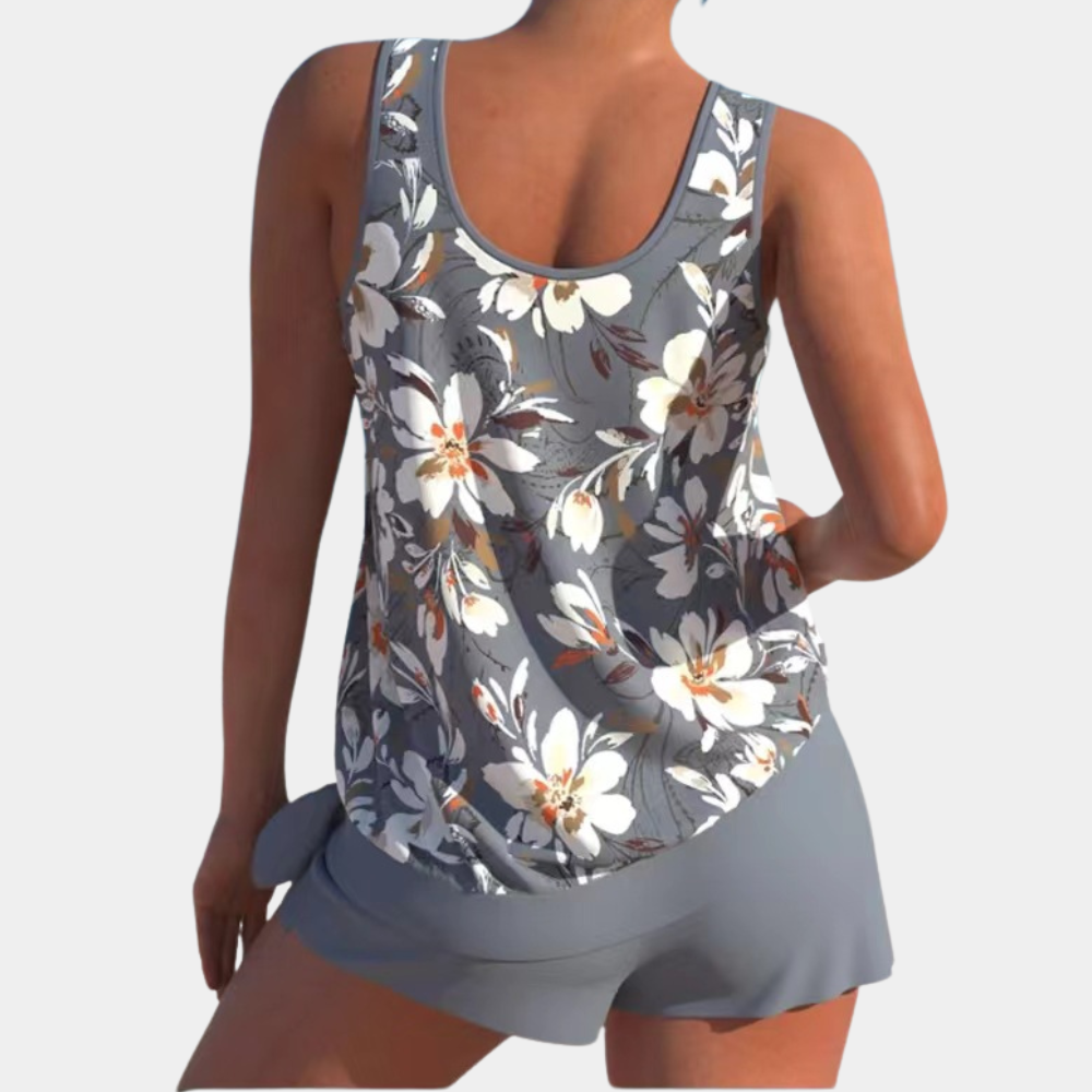 Top canotta donna floreale grigio, senza maniche, con pantaloncini abbinati. Moda estiva casual, abbigliamento donna, tessuto leggero e traspirante.