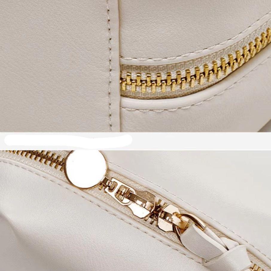 Borsa in pelle bianca con cerniera dorata, dettaglio di chiusura lampo e cuciture. Accessorio moda elegante, ideale per donna.