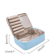 Astuccio portagioie da viaggio azzurro, dimensioni 23x17x8 cm, con scomparti per anelli e specchio. Organizzatore gioielli compatto ed elegante.