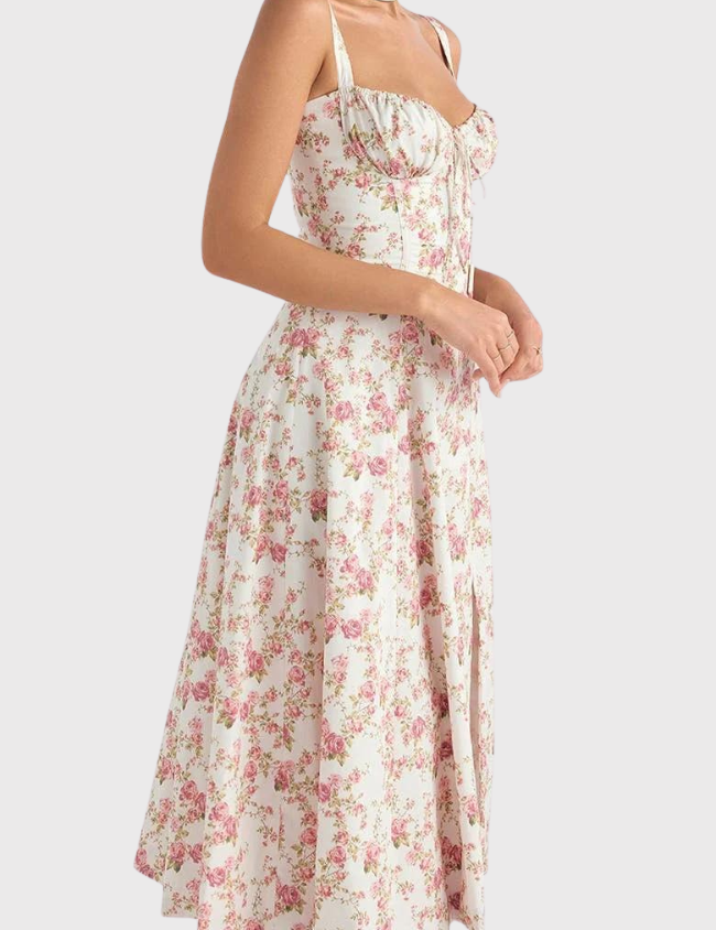 Abito estivo donna a fiori rosa, lunghezza midi, spalline sottili, scollo a cuore, stile vintage. Perfetto per occasioni casual e primaverili.