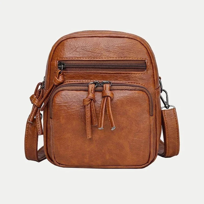 Borsa a tracolla in pelle marrone, design compatto con doppie cerniere, ideale per uomo e donna. Accessorio moda versatile e pratico.