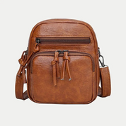 Borsa a tracolla in pelle marrone, design compatto con doppie cerniere, ideale per uomo e donna. Accessorio moda versatile e pratico.