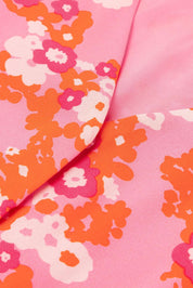 Giacca rosa con motivo floreale arancione e bianco, tessuto di alta qualità, moda donna, abbigliamento elegante, stile primaverile vivace.