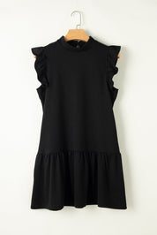 Abito nero senza maniche con volant, design elegante e moderno, perfetto per occasioni formali e casual. Tessuto morbido e confortevole.