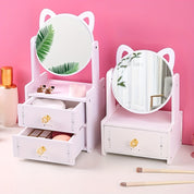 Specchio da trucco con orecchie di gatto, design moderno, cassetti portaoggetti, colore bianco, sfondo rosa, ideale per camera da letto o bagno.