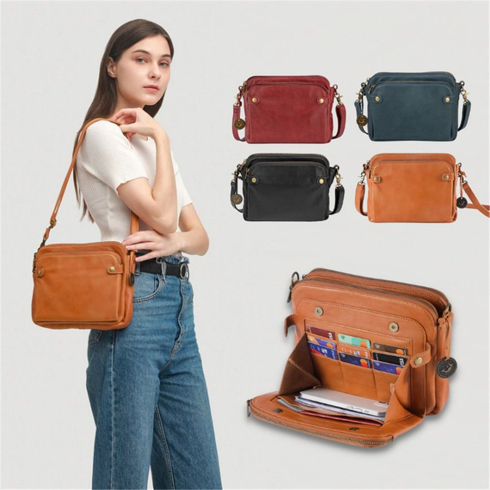 Donna con borsa a tracolla in pelle marrone, tasche multiple. Altre borse in rosso, nero, blu. Design elegante, moda donna, accessori versatili.