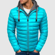 Giacca invernale uomo turchese con cappuccio grigio, imbottita, chiusura zip, stile casual, ideale per freddo, moda autunno inverno.