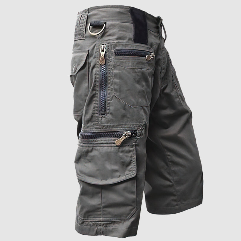 Pantaloncini cargo uomo grigi, multi-tasche con zip, design casual e resistente, ideale per attività all'aperto e tempo libero.
