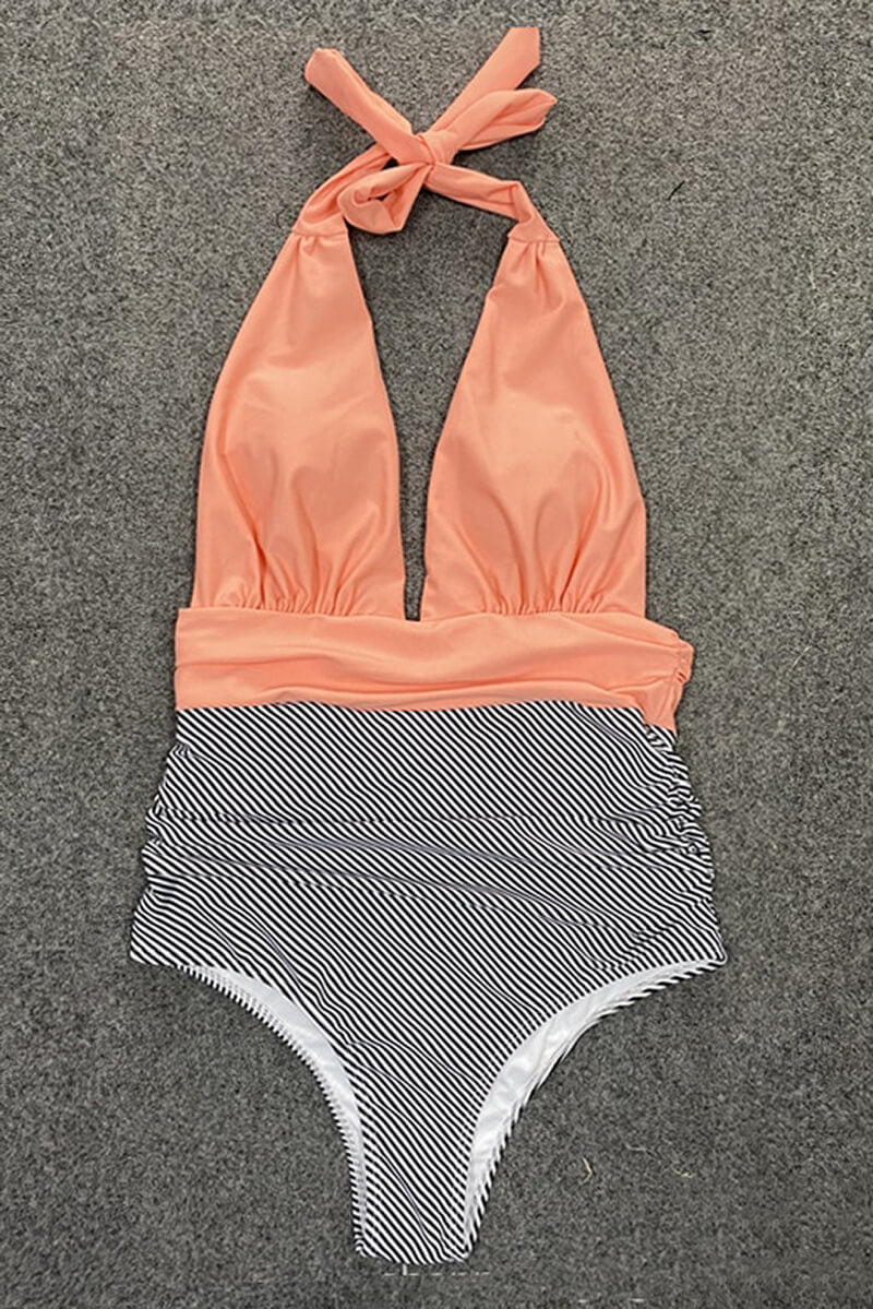 Costume intero donna, design a righe bianche e nere, top arancione con scollo all'americana. Elegante e moderno, perfetto per l'estate.