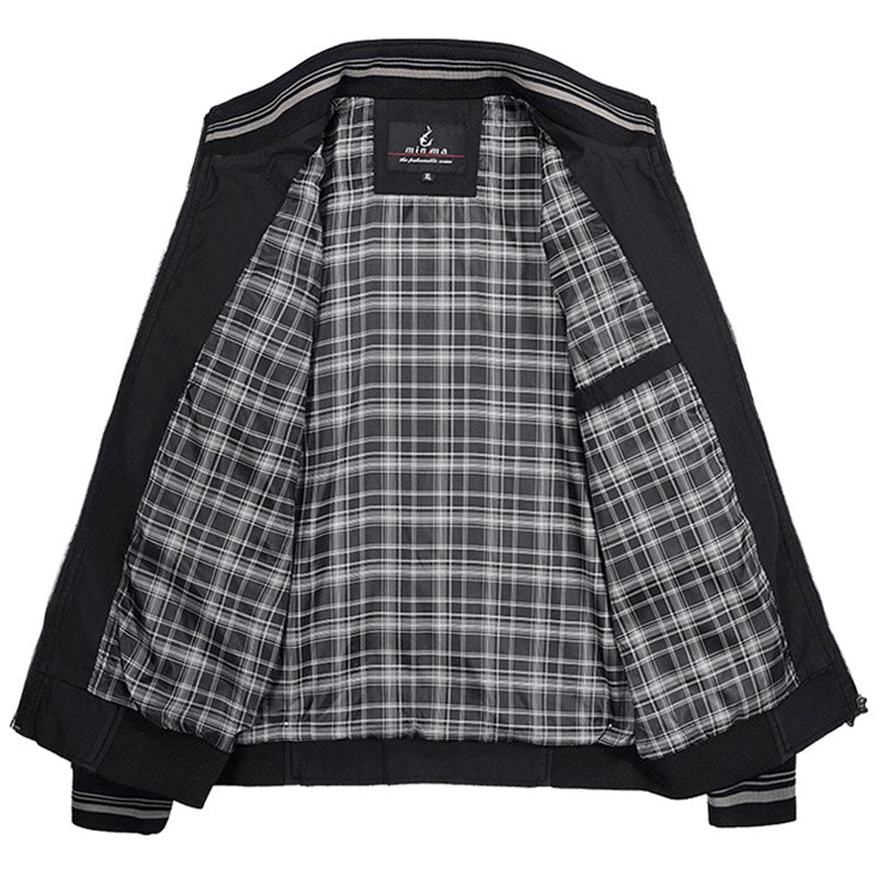 Giacca nera da uomo con fodera a quadri, design casual, chiusura con zip, ideale per autunno e primavera. Stile versatile e moderno.