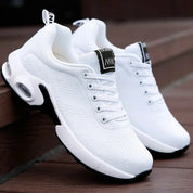 Scarpe da ginnastica bianche unisex, design moderno, suola ammortizzata, tessuto traspirante, ideali per sport e tempo libero.