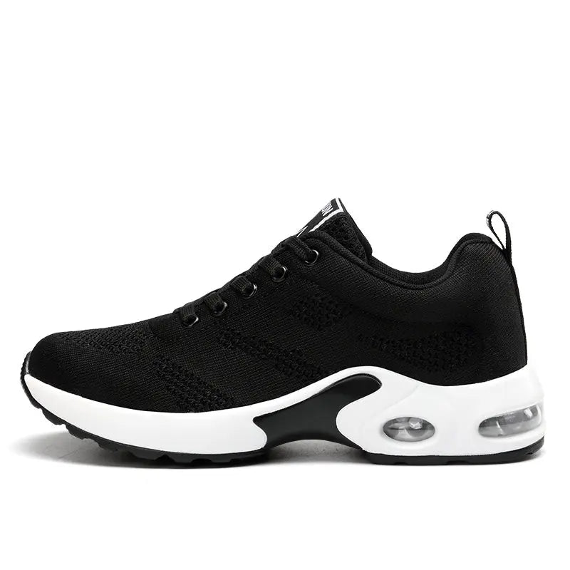 Scarpa da ginnastica nera unisex con suola bianca, design traspirante, ammortizzazione ad aria, ideale per corsa e sport. Sneakers moda comode.