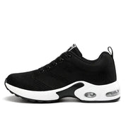 Scarpa da ginnastica nera unisex con suola bianca, design traspirante, ammortizzazione ad aria, ideale per corsa e sport. Sneakers moda comode.