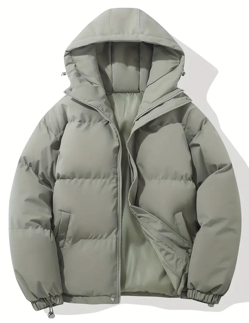 Giacca invernale imbottita grigia con cappuccio, design trapuntato, chiusura a zip, ideale per climi freddi. Moda uomo, abbigliamento outdoor.